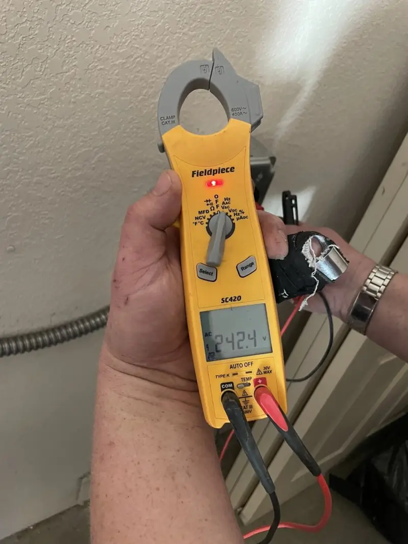 Voltage testing with clamp meter during Ceiling Fan Installation in Newmarket